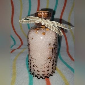 Pink glass bottle with orange blossom bath salts